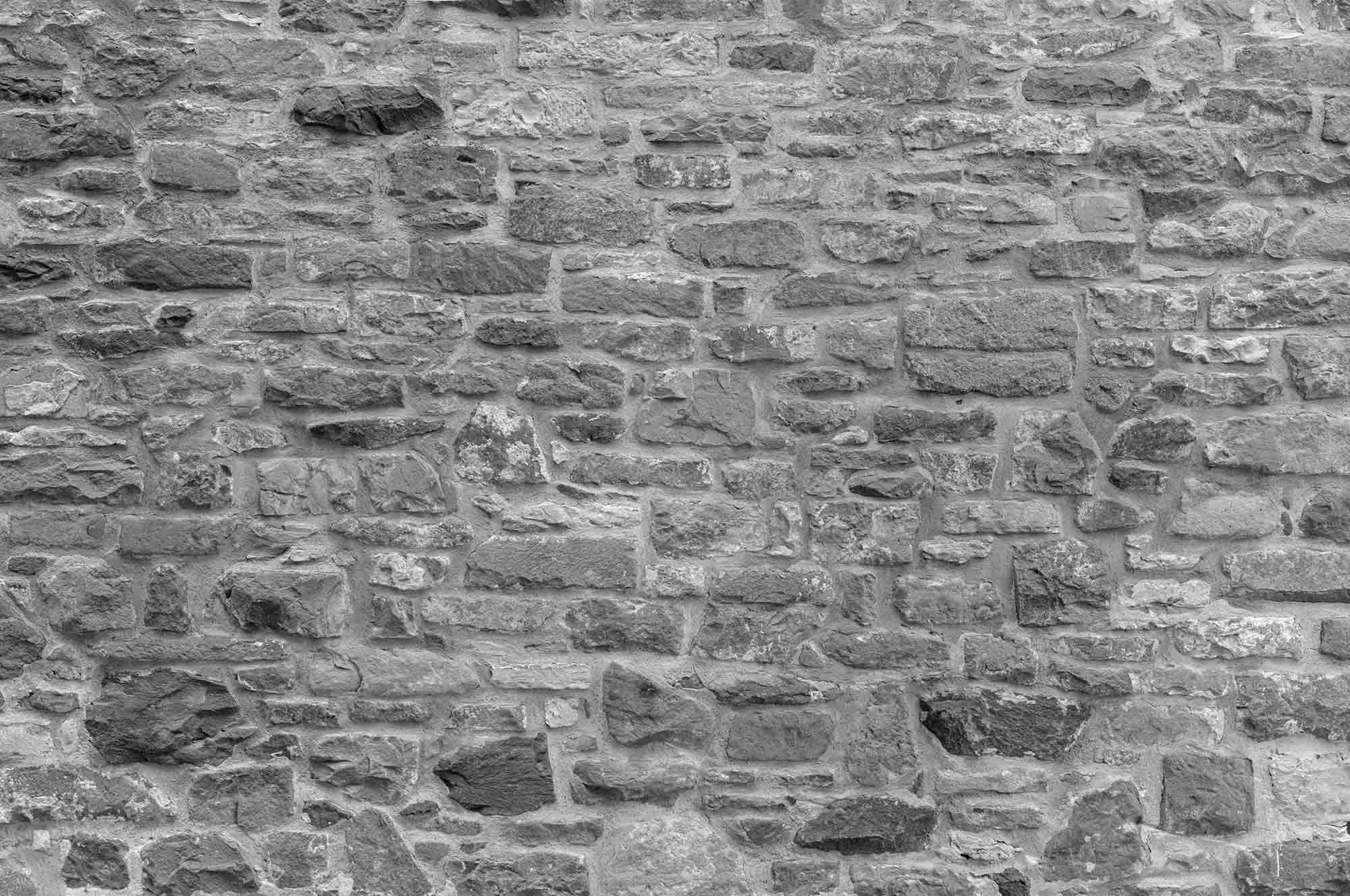 Текстура камня. Серый каменный фон для фотошопа. Черная матовая стена из мелкого кирпича высокого качества. Stone Grey.
